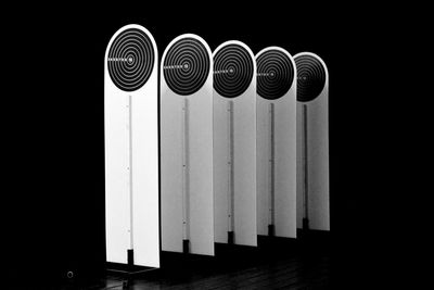 Close-up of piano against black background