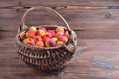 High angle view of fruits in basket on table