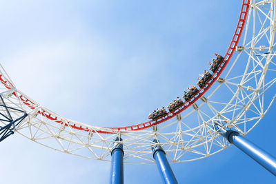 Low angle view of ferris wheel against clear sky