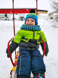 Low section of man standing on snow
