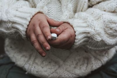 Close-up mid section of baby holding chalk