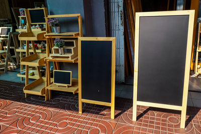 Empty chairs and tables in building