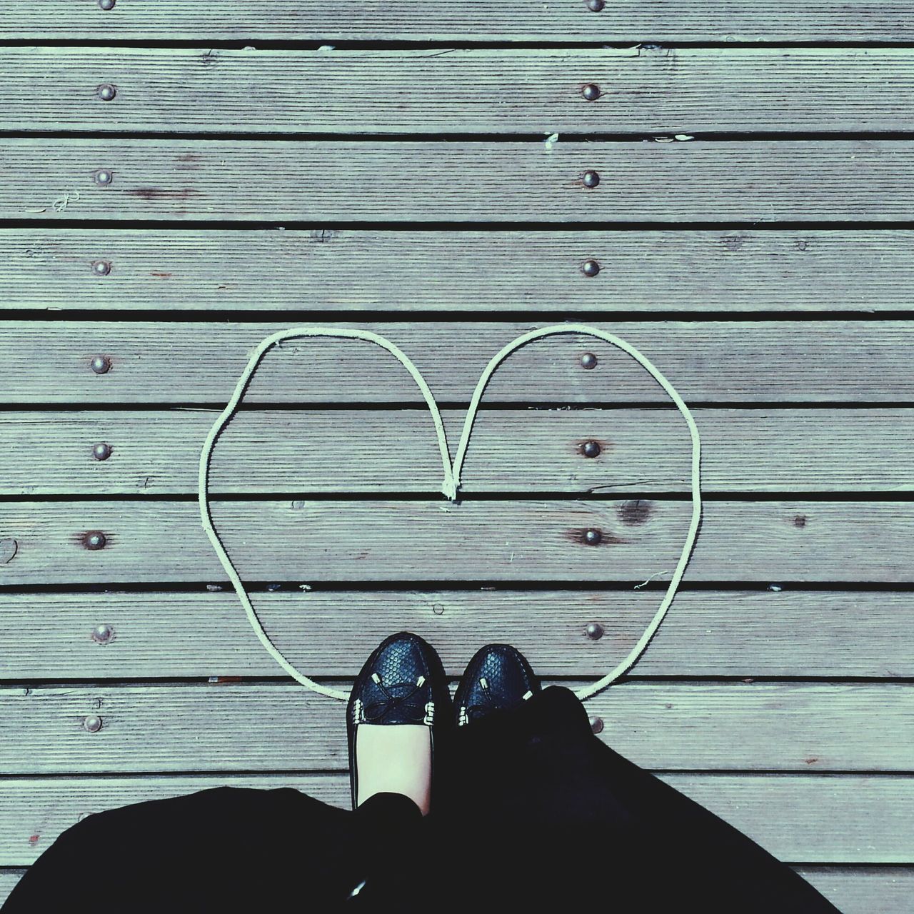 wood - material, shoe, wooden, personal perspective, low section, person, wood, plank, footwear, part of, standing, high angle view, human foot, close-up, indoors, hardwood floor, brown