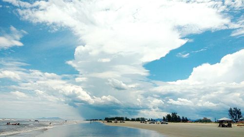 Scenic view of sea against cloudy sky