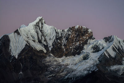 Scenic view of snowcapped mountain against sky