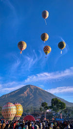 View of hot air balloons against sky