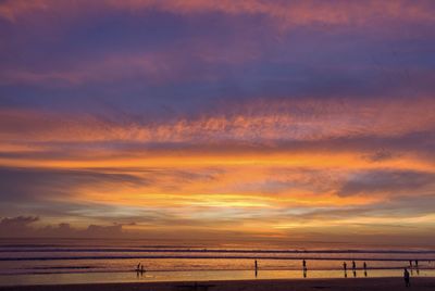 Scenic view of beach against sky during sunset