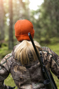 Woman hunting in forest