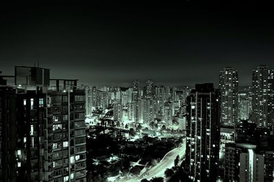 High angle view of city lit up at night