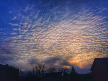 Low angle view of cloudy sky at sunset