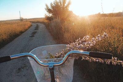 View of bicycle on dirt road