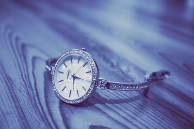 Close-up of clock on table