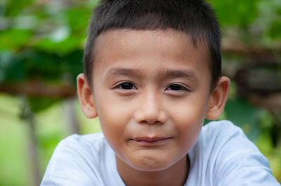 Close-up portrait of smiling cute boy