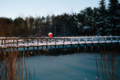 Scenic view of river against sky during winter