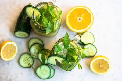 High angle view of smoothie in jar by cucumber slices