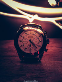 Close-up of clock on table