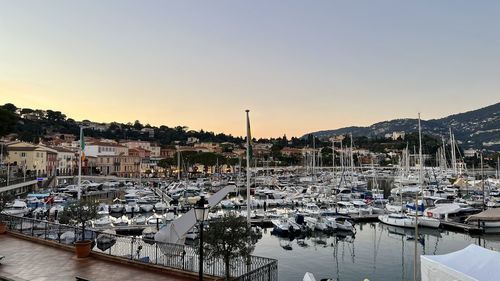 Boats moored at harbor