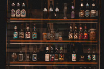 View of bottles on shelf at home