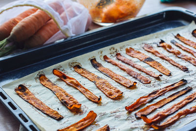 Fresh cooked carrot bacon is on the table. vegetarian food, meat replacement, protein