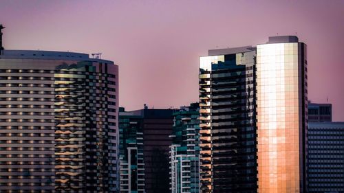 Skyscrapers in city against sky