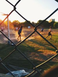 People playing soccer in a park