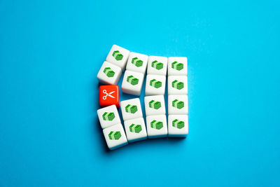 Directly above shot of dices on blue background