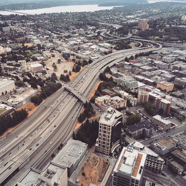 architecture, aerial view, built structure, building exterior, cityscape, city, high angle view, crowded, residential district, residential building, transportation, city life, residential structure, elevated view, road, landscape, outdoors, travel, travel destinations, capital cities