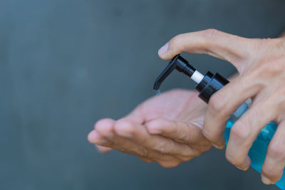 Close-up of man holding hands