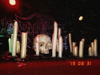 Statue in illuminated temple at night