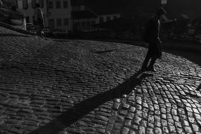 Man walking on street in city