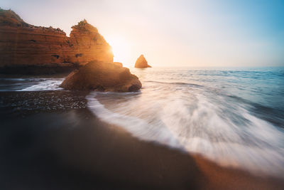 Scenic view of sea against sky during sunset