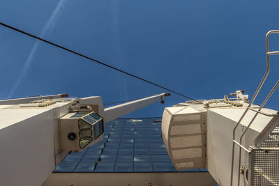 Low angle view of electricity pylon against sky