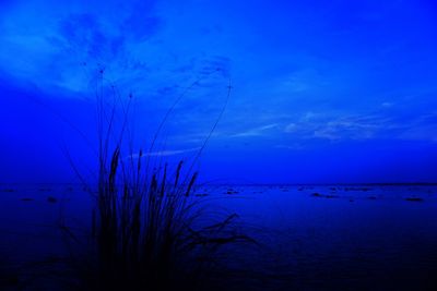 Scenic view of sea against sky at dusk