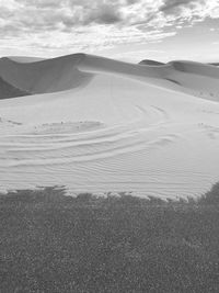 Aerial view of desert land against sky