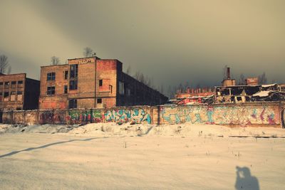 View of buildings against sky during winter