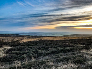 Scenic view of landscape against sky during sunset