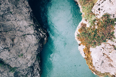 High angle view of river amidst mountains