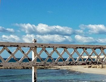 Pier over sea against sky