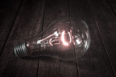 Close-up of illuminated light bulb