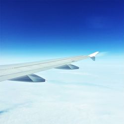 Low angle view of airplane flying in sky