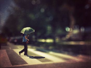 Woman waling on zebra crossing