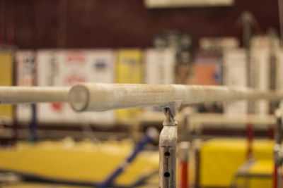 Close-up of bicycle on railing against blurred background