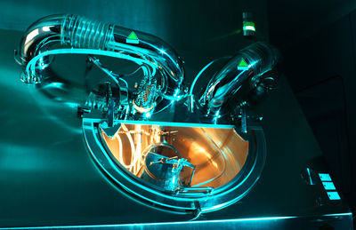 Close-up of illuminated machine in factory