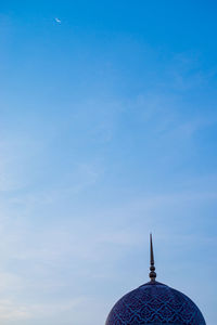 Low angle view of building against blue sky