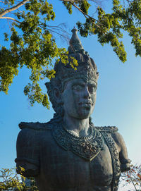 Low angle view of statue against sky