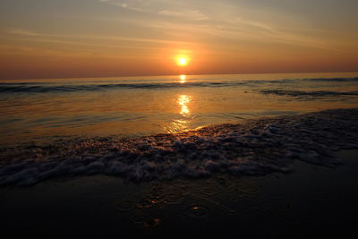 Scenic view of sea against sky during sunset