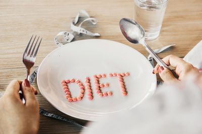 Midsection of person preparing food on table