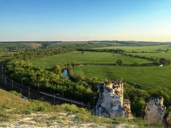 Scenic view of field against clear sky