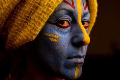 Close-up portrait of young woman wearing mask