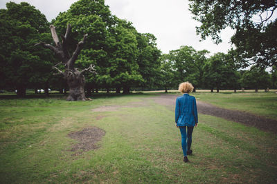 Rear view of woman walking in park